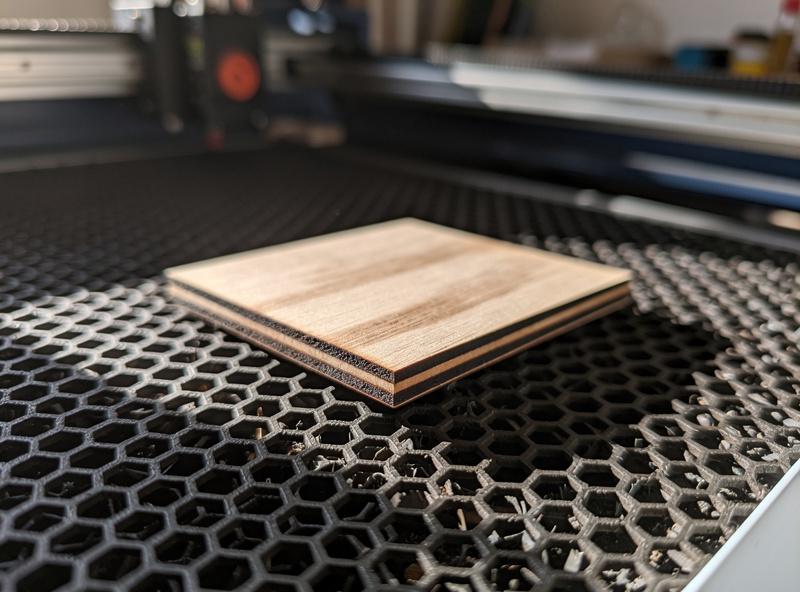 First successful LightBurn cut on plywood with clean burned edges and finished workpiece