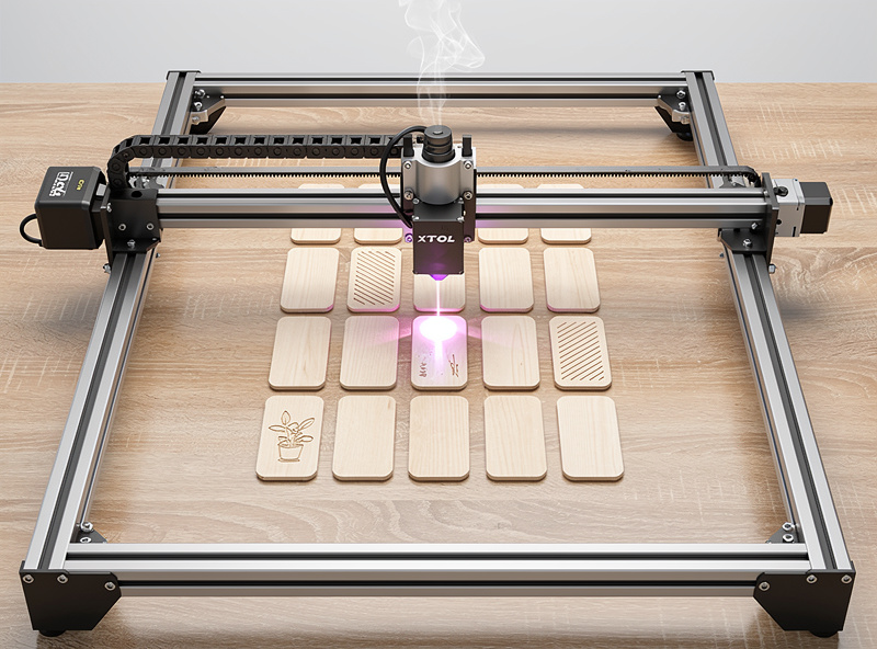 xTool D1 Pro diode laser engraver actively engraving small plant tag wood blanks