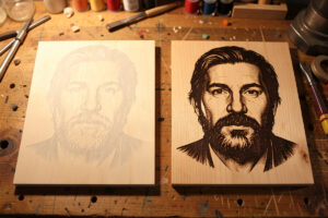 A faint washed-out laser-engraved wood portrait beside a crisp dark corrected one