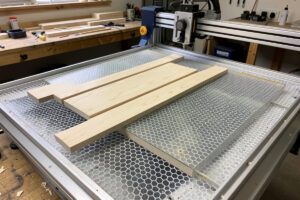 Honeycomb bed versus slat bed work surfaces for a laser engraver